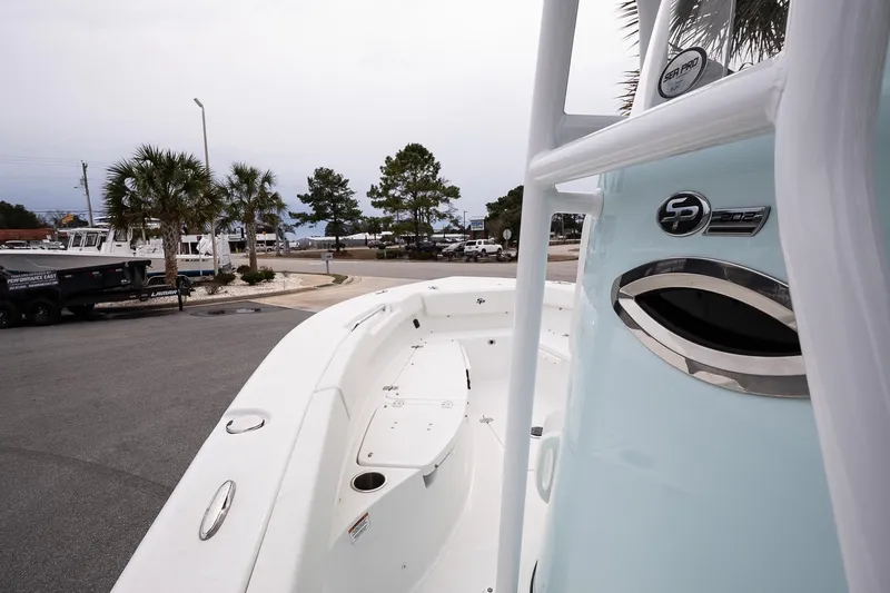 Slide: The Image of 2026 Sea Pro 202 Center Console boat, docked with palm trees in the background. - 12