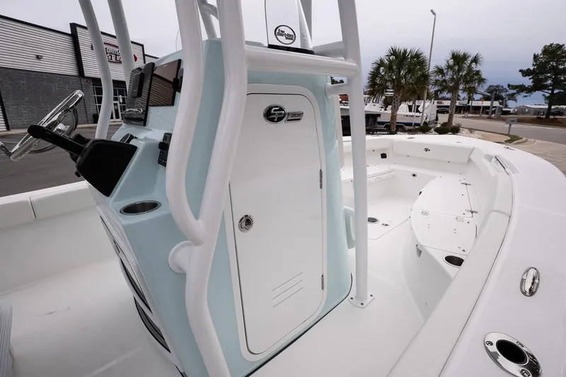Slide: The Image of 2026 Sea Pro 202 Center Console boat interior with steering wheel and seating area. - 13