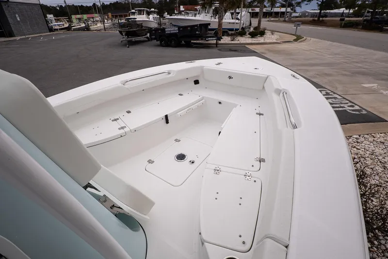 Slide: The Image of 2026 Sea Pro 202 Center Console boat, spacious deck, white finish, outdoor setting. - 14