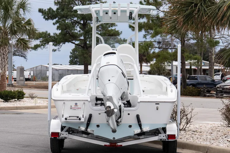 Slide: The Image of 2026 Sea Pro 202 Center Console boat on trailer, parked outdoors. - 5