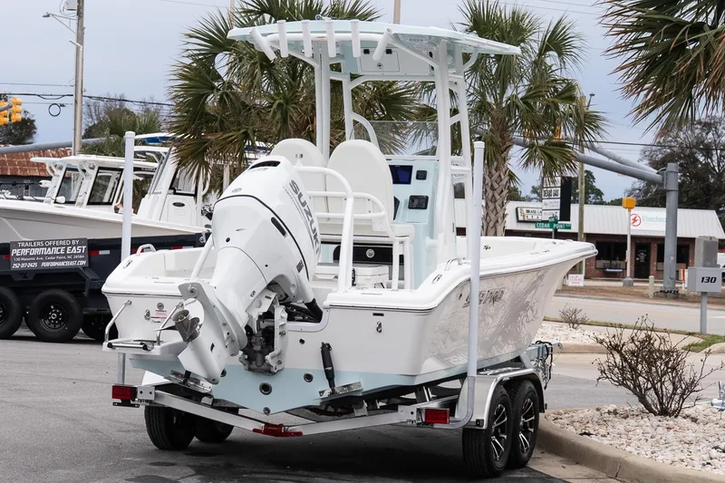 Slide: The Image of 2026 Sea Pro 202 Center Console boat on trailer, featuring Suzuki outboard motor. - 6