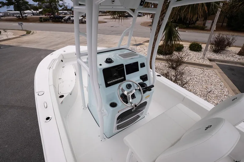 Slide: The Image of 2026 Sea Pro 202 Center Console boat interior with steering wheel and seating. - 8