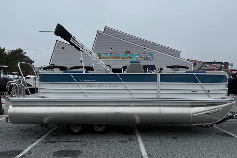 The Image of 2026 Berkshire 22RFX LE pontoon boat in a parking lot, side view. - 1