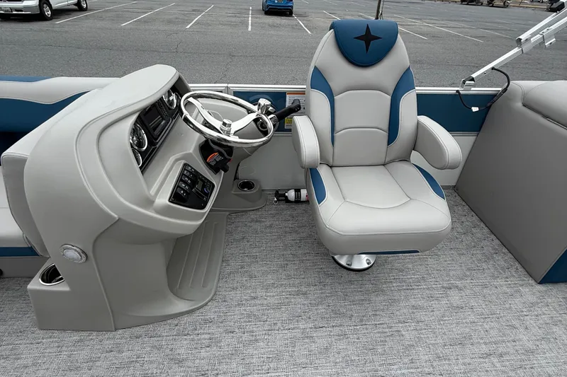 Slide: The Image of 2026 Berkshire 22RFX LE boat interior with steering console and captain's chair. - 10