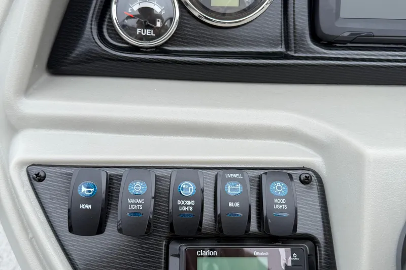 Slide: The Image of Dashboard controls of 2026 Berkshire 22RFX LE boat with fuel gauge and switches. - 12
