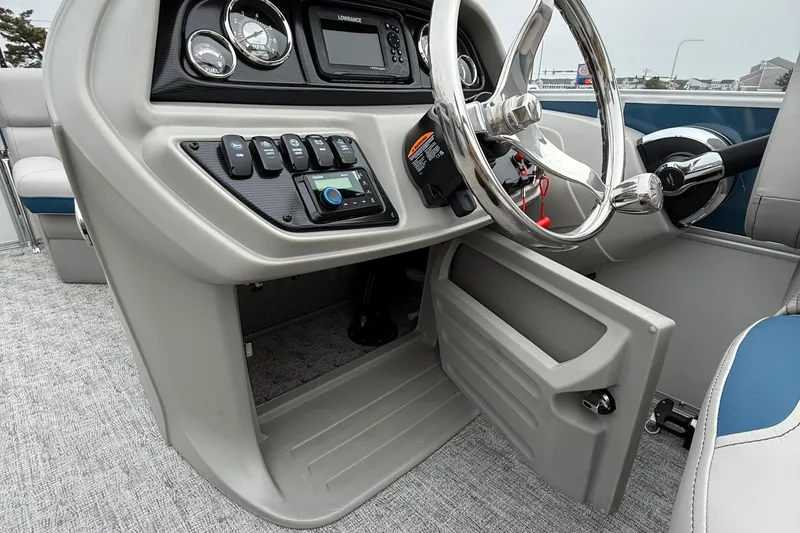Slide: The Image of 2026 Berkshire 22RFX LE boat dashboard with steering wheel and control panel. - 15