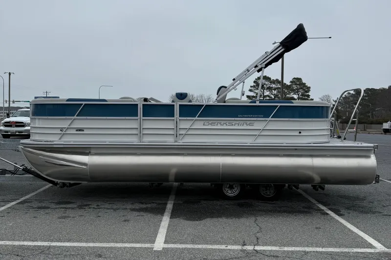 Slide: The Image of 2026 Berkshire 22RFX LE pontoon boat in parking lot, side view. - 4