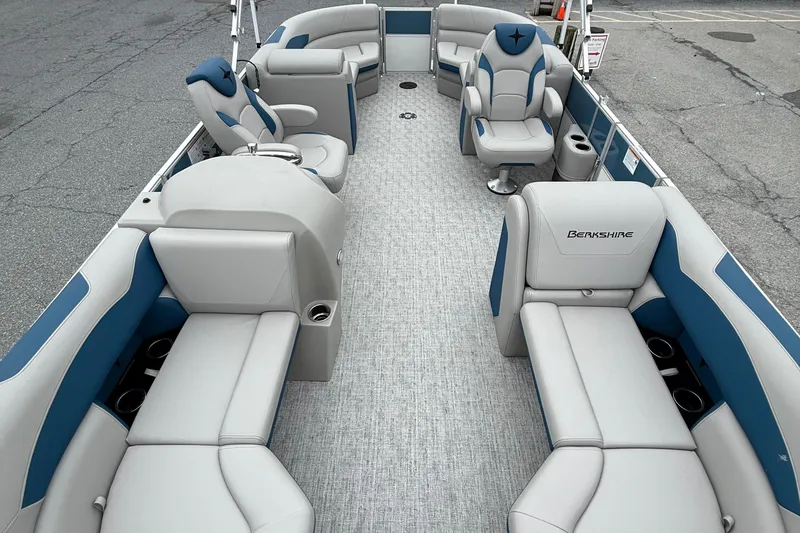 Slide: The Image of 2026 Berkshire 22RFX LE pontoon boat interior with plush seating and modern design. - 7