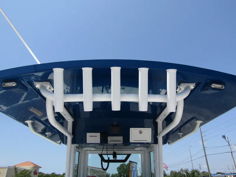 Slide: The Image of 2024 Wellcraft 243 Fisherman boat top view with rod holders and electronics. - 37