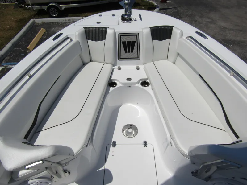 Slide: The Image of 2024 Wellcraft 243 Fisherman boat with white cushioned seating area. - 9