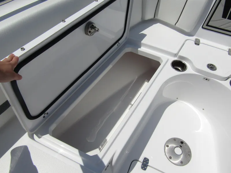 Slide: The Image of 2024 Wellcraft 243 Fisherman boat storage compartment and seating area. - 11