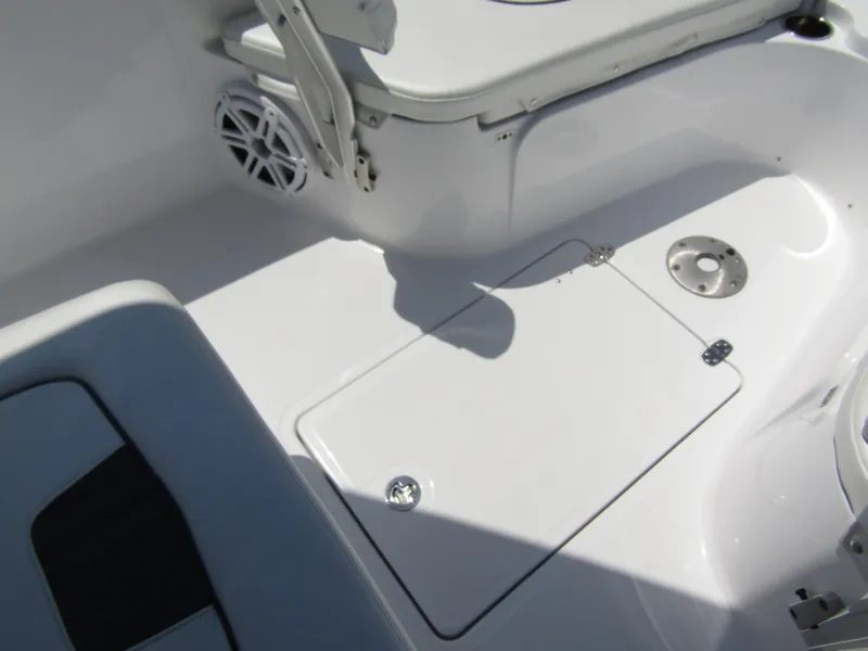 Slide: The Image of 2024 Wellcraft 243 Fisherman boat interior, featuring storage compartment and seating area. - 14