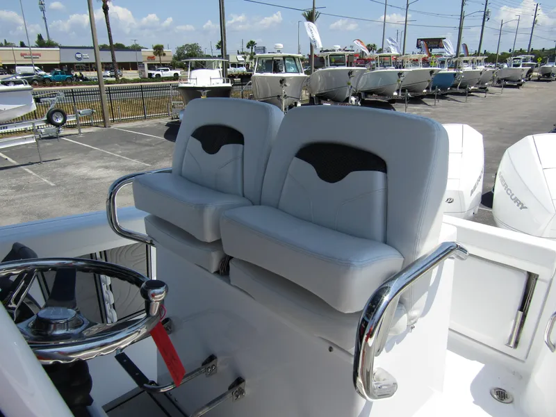 Slide: The Image of 2024 Wellcraft 243 Fisherman boat seats and steering wheel. - 18