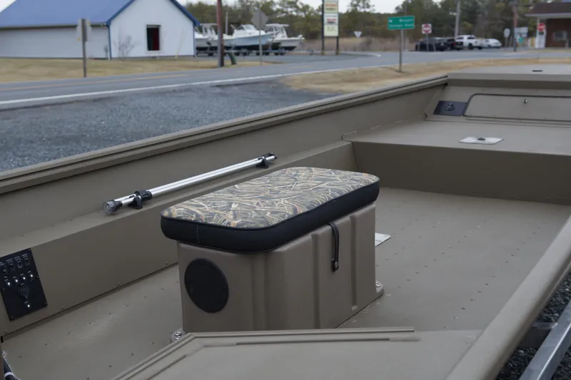 Slide: The Image of 2026 G3 Gator Tough 16 FL boat interior with camo seat and control panel. - 10