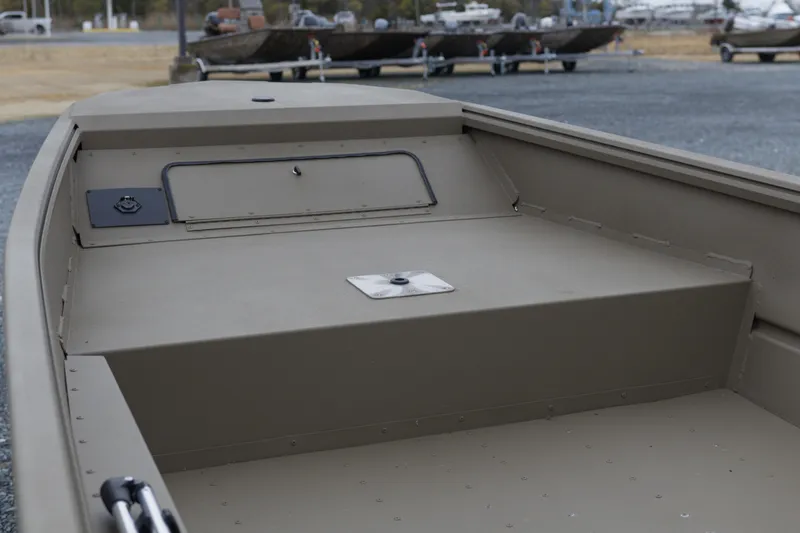 Slide: The Image of 2026 G3 Gator Tough 16 FL boat interior, showcasing storage compartment and deck. - 7