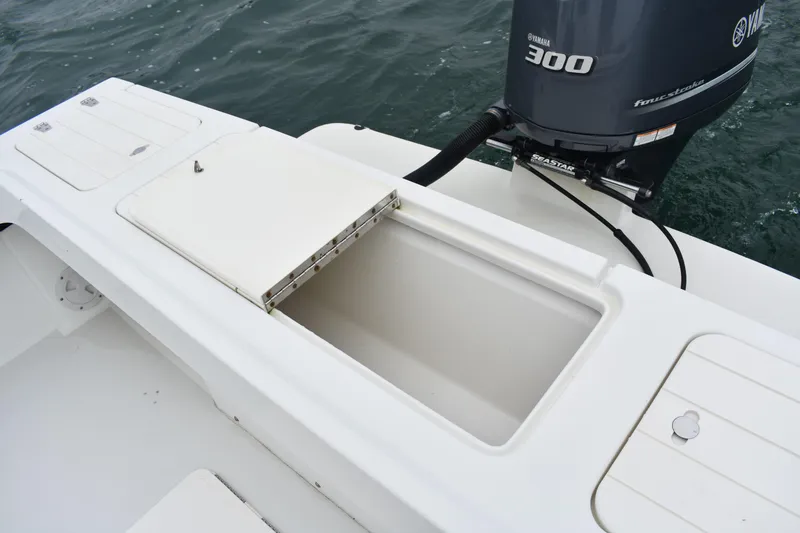 Slide: The Image of 2015 Parker 2320 SL Sport Cabin boat with Yamaha 300 engine, open storage compartment. - 11