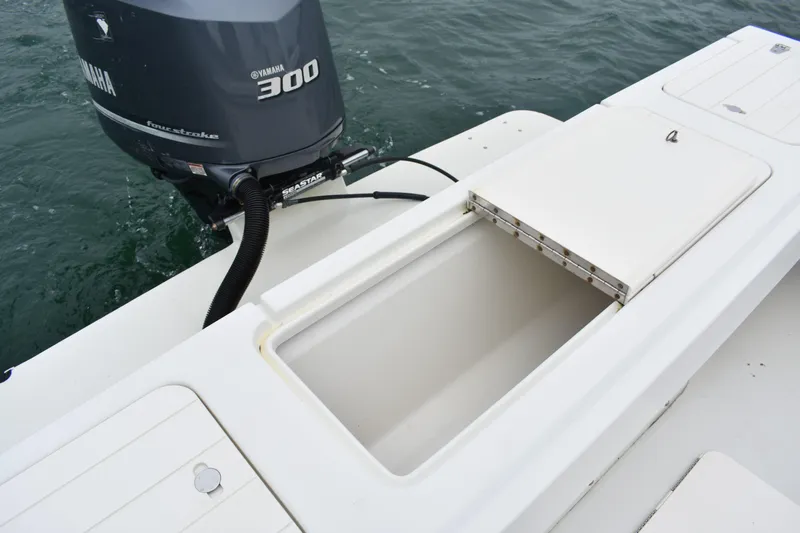 Slide: The Image of 2015 Parker 2320 SL Sport Cabin boat with Yamaha 300 engine, open storage compartment. - 15