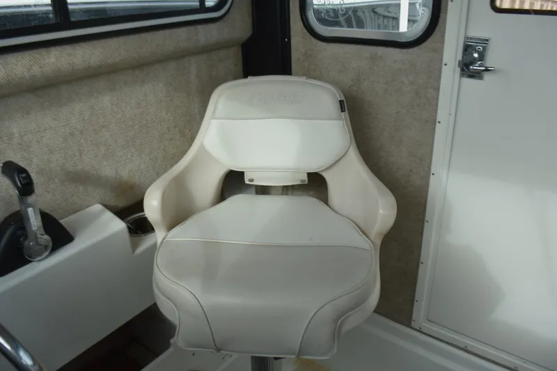 Slide: The Image of Captain's chair in 2015 Parker 2320 SL Sport Cabin boat interior. - 20