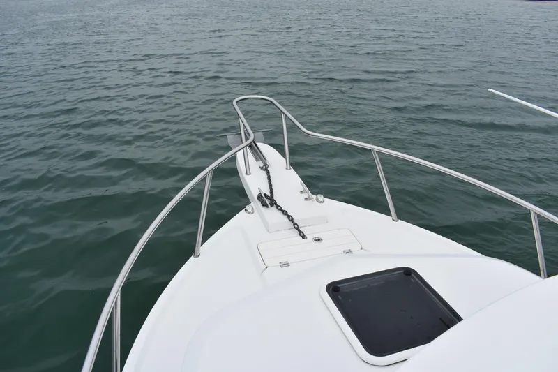 Slide: The Image of Bow view of 2015 Parker 2320 SL Sport Cabin on calm water. - 7