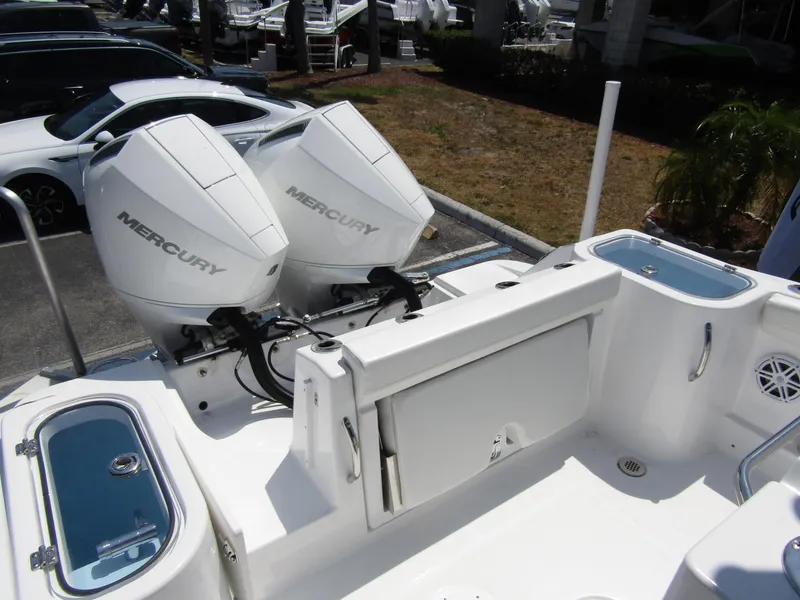 Slide: The Image of 2024 Wellcraft 243 Fisherman boat with dual Mercury outboard engines. - 30
