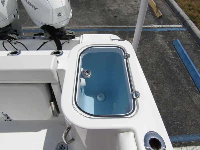 Slide: The Image of 2024 Wellcraft 243 Fisherman boat livewell and twin Mercury outboard motors. - 34