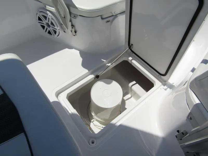 Slide: The Image of 2024 Wellcraft 243 Fisherman boat storage compartment with open hatch. - 15