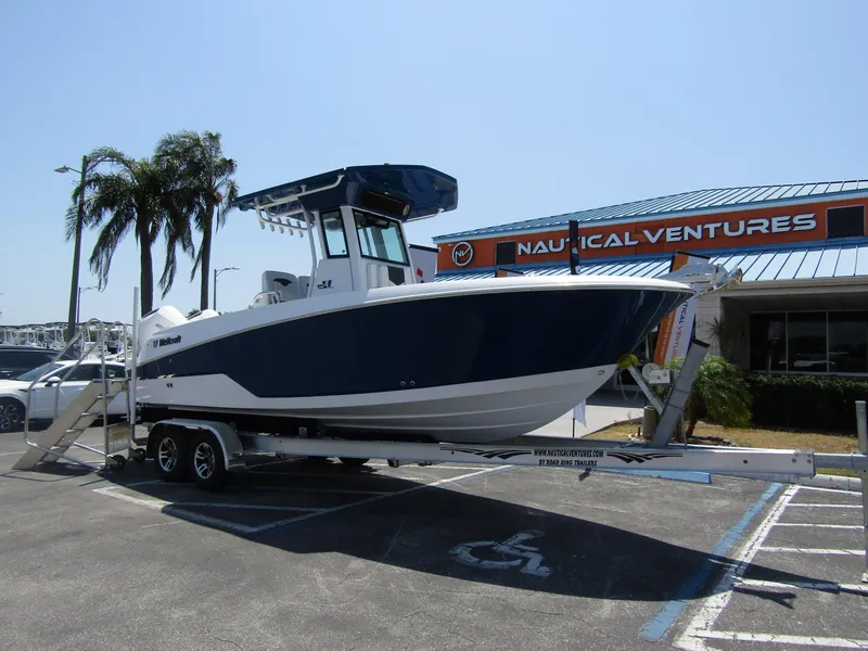 Slide: The Image of 2024 Wellcraft 243 Fisherman boat on a trailer at Nautical Ventures dealership. - 5