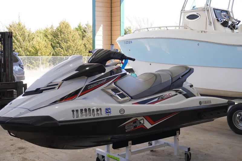 Slide: The Image of 2014 Yamaha WaveRunner FX SHO jet ski in a garage setting. - 2