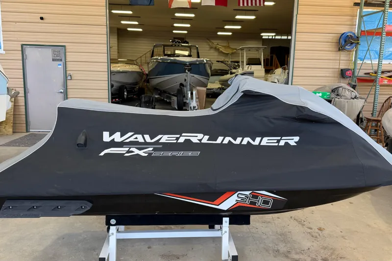 Slide: The Image of 2014 Yamaha WaveRunner FX SHO covered in storage, with boats in the background. - 5