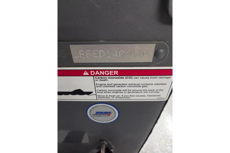 Slide: The Image of 2006 Lund 1775 Classic Sport warning label with carbon monoxide safety information. - 14