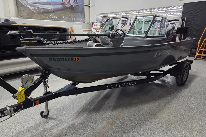 Slide: The Image of 2006 Lund 1775 Classic Sport boat on EZ Loader trailer in showroom. - 5