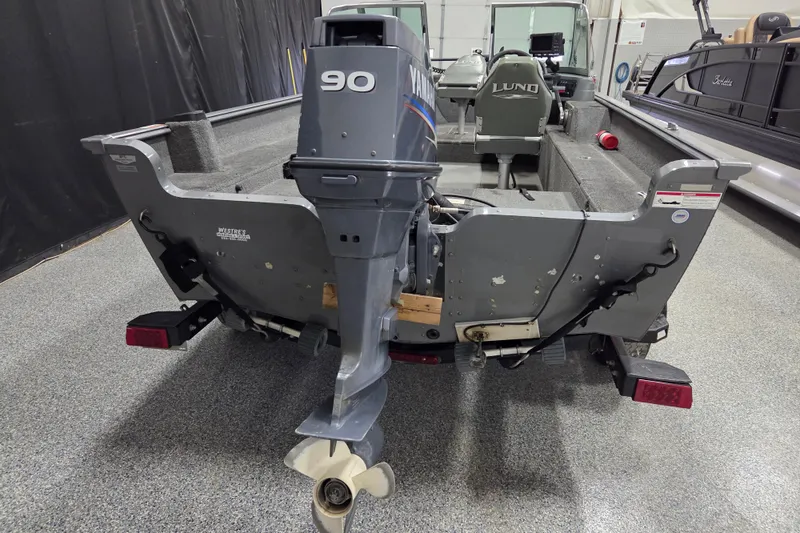 Slide: The Image of 2006 Lund 1775 Classic Sport boat with Yamaha 90 outboard motor in a showroom. - 6