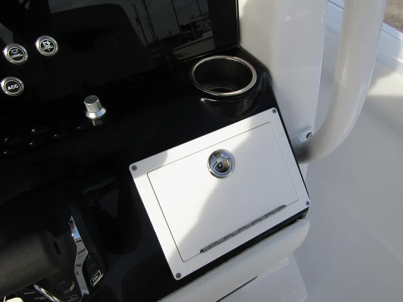 Slide: The Image of 2025 Wellcraft 243 Fisherman console with cup holder and storage compartment. - 21