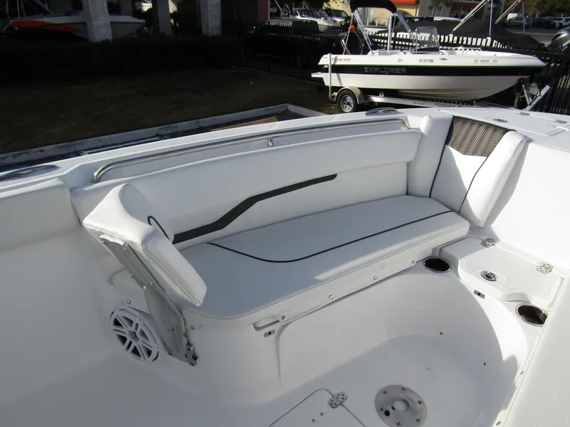 Slide: The Image of 2025 Wellcraft 243 Fisherman boat interior with white seating and cup holders. - 7
