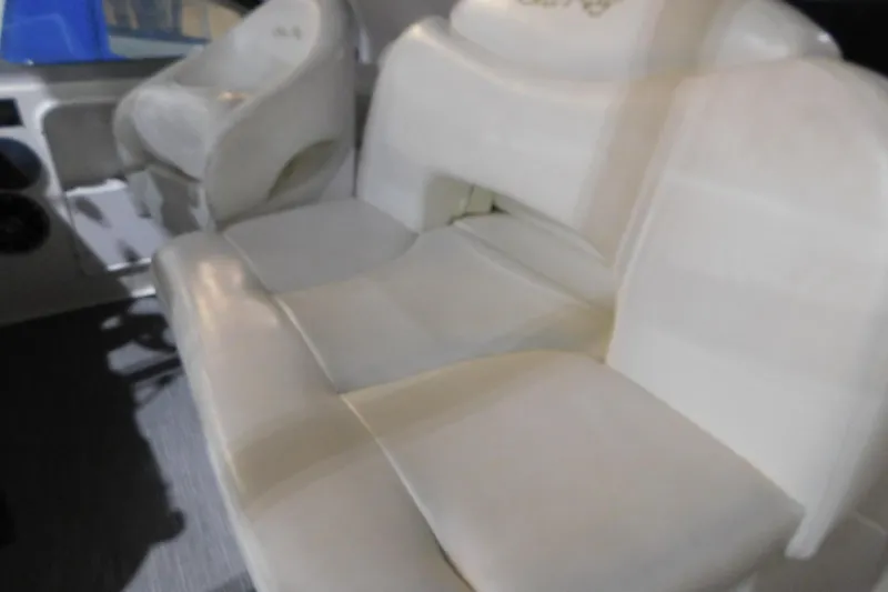 Slide: The Image of 2002 Sea Ray 340 Sundancer boat interior with white leather seating. - 11