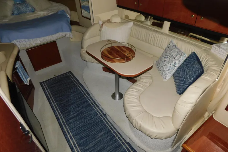 Slide: The Image of 2002 Sea Ray 340 Sundancer interior with cozy seating and elegant decor. - 18