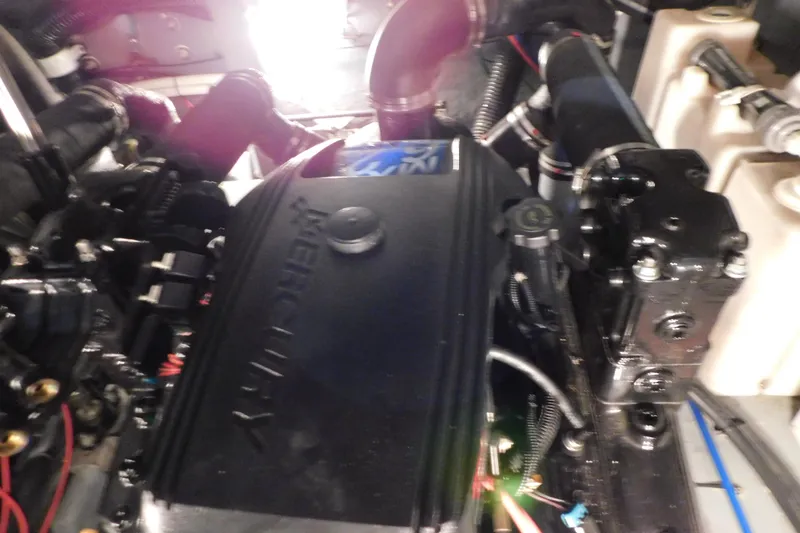 Slide: The Image of Engine compartment of a 2002 Sea Ray 340 Sundancer boat, featuring a Mercury engine. - 29