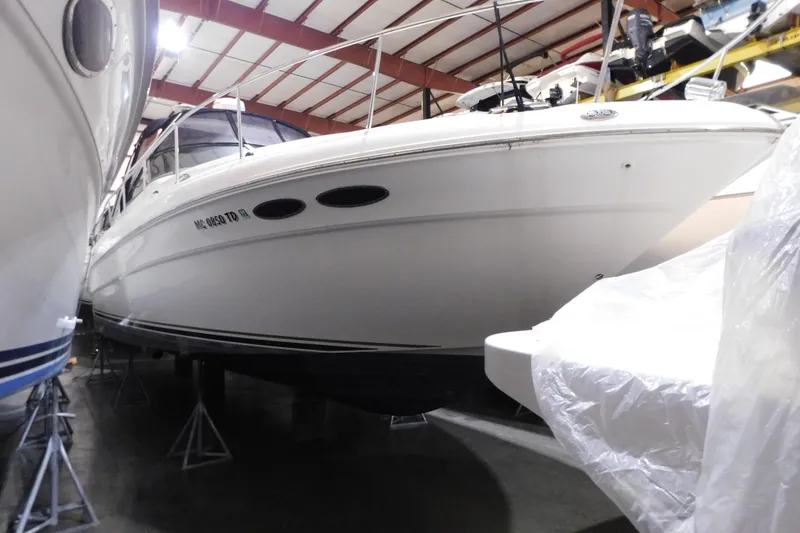 Slide: The Image of 2002 Sea Ray 340 Sundancer yacht in indoor storage facility. - 3