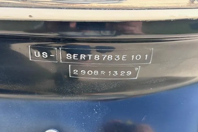 Slide: The Image of 2001 Sea Ray 290 Bowrider hull identification number on dark surface. - 11