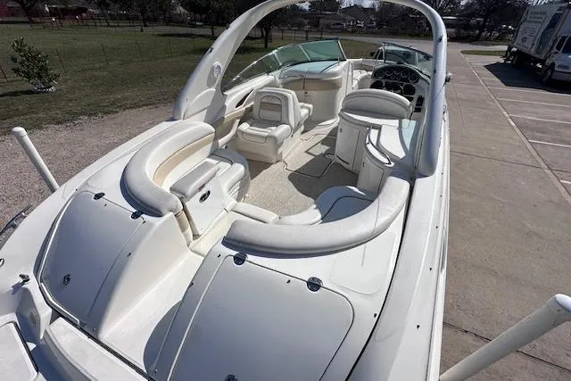 Slide: The Image of 2001 Sea Ray 290 Bowrider boat with spacious seating and sleek design. - 12