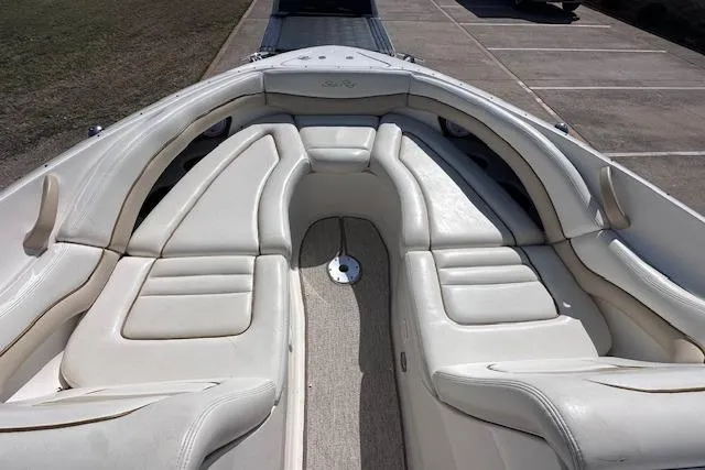Slide: The Image of 2001 Sea Ray 290 Bowrider with spacious white leather seating in the bow area. - 15