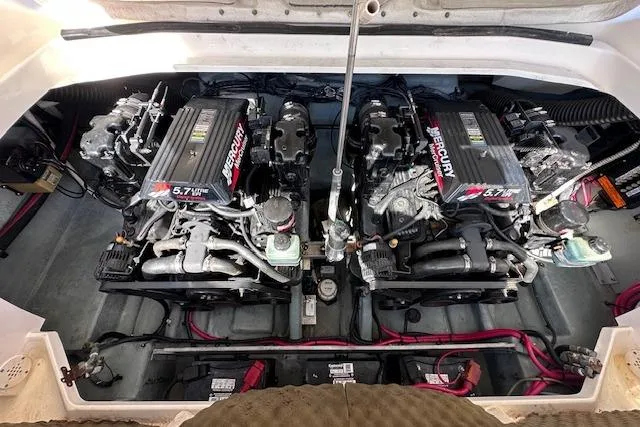 Slide: The Image of Twin Mercury engines in a 2001 Sea Ray 290 Bowrider boat engine compartment. - 29