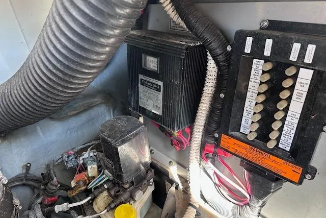 Slide: The Image of Engine compartment of a 2001 Sea Ray 290 Bowrider, showing electrical components and wiring. - 31