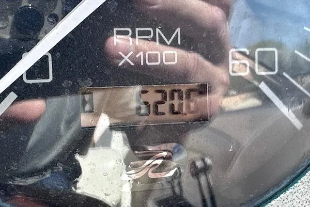 Slide: The Image of Close-up of 2001 Sea Ray 290 Bowrider tachometer showing 520 RPM. - 34
