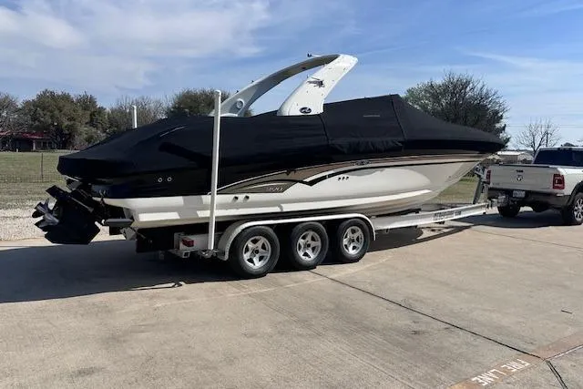 Slide: The Image of 2001 Sea Ray 290 Bowrider on trailer, covered, parked outdoors. - 36