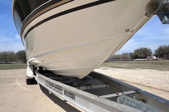 Slide: The Image of 2001 Sea Ray 290 Bowrider on trailer, parked outdoors on a sunny day. - 6