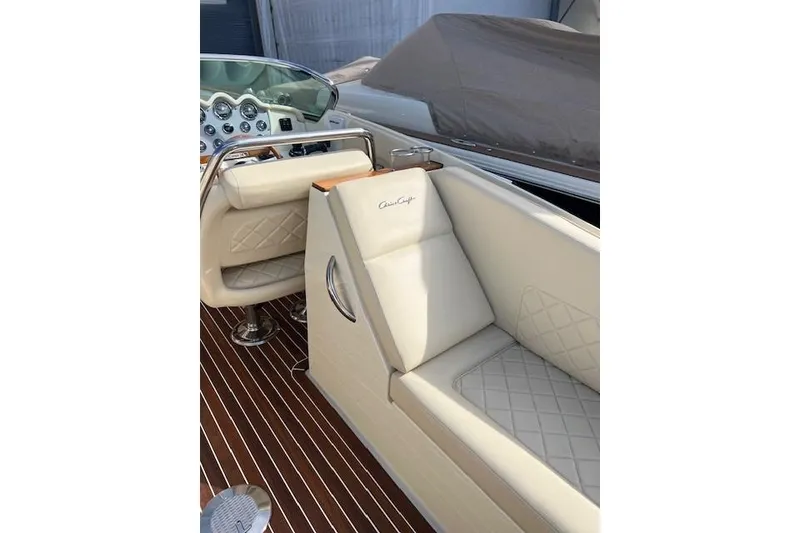 Slide: The Image of Luxurious interior of 2017 Chris-Craft Corsair 32 with elegant cream seating and polished dashboard. - 13