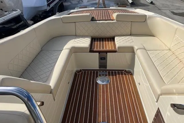 Slide: The Image of Luxurious interior of 2017 Chris-Craft Corsair 32 boat with elegant seating and wood flooring. - 14