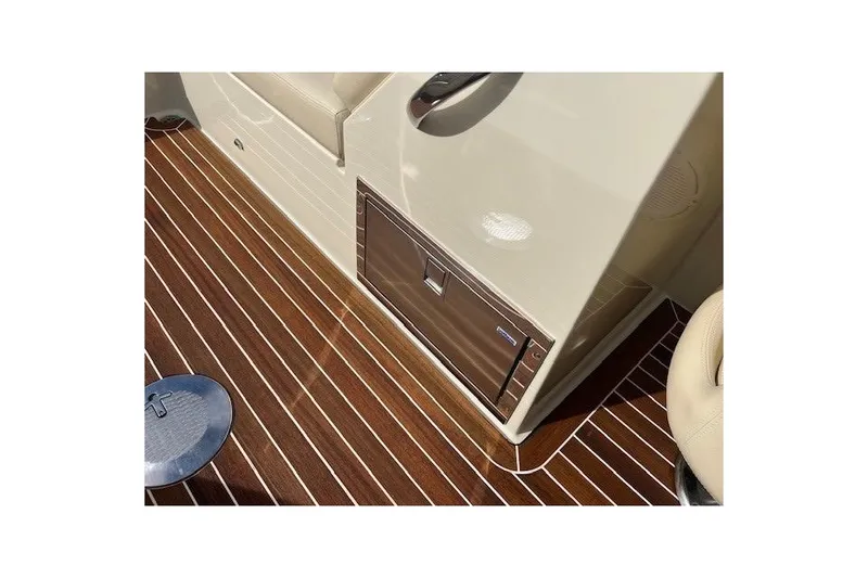 Slide: The Image of 2017 Chris-Craft Corsair 32 interior with sleek wood flooring and modern design elements. - 15