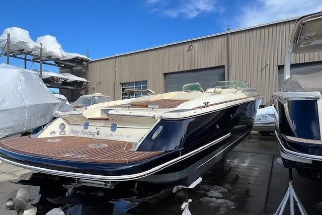 Slide: The Image of 2017 Chris-Craft Corsair 32 boat in storage, Southampton, NY, with blue hull and wooden deck. - 4